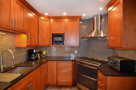 glass tile backsplash cherry cabinets stainless steel countertops|cherry subway cabinet backsplash.